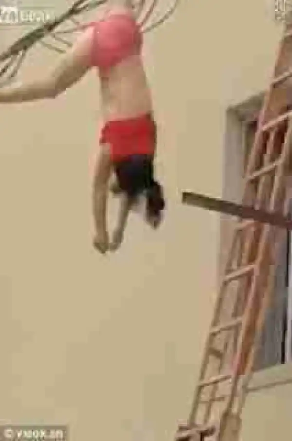 Half-N@ked Woman Found Dangling On Electric Cables In China After Lover’s Wife Arrived Home Earlier Than Expected [photo]